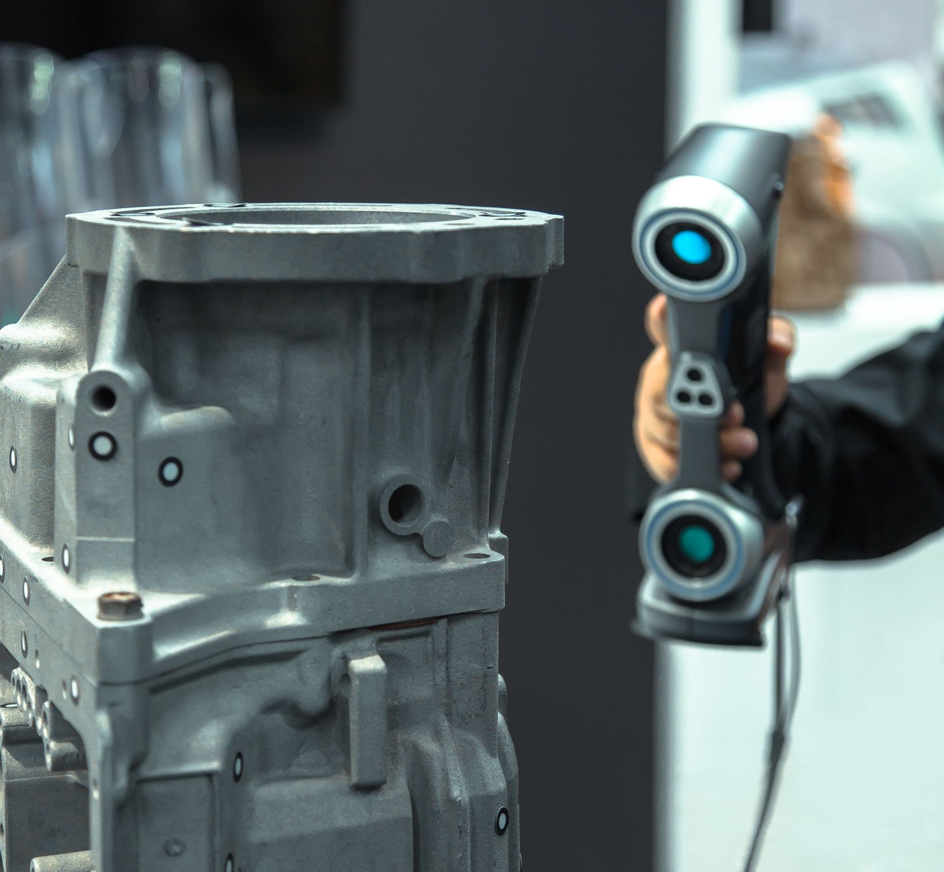 Handheld 3D scanner capturing an aluminium engine block for geometry reconstruction